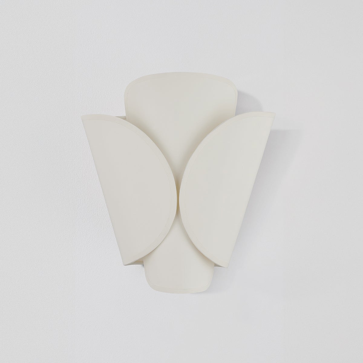 Savoie Wall Sconce in aged brass shown from the front to reveal the arm curve and shade silhouette.