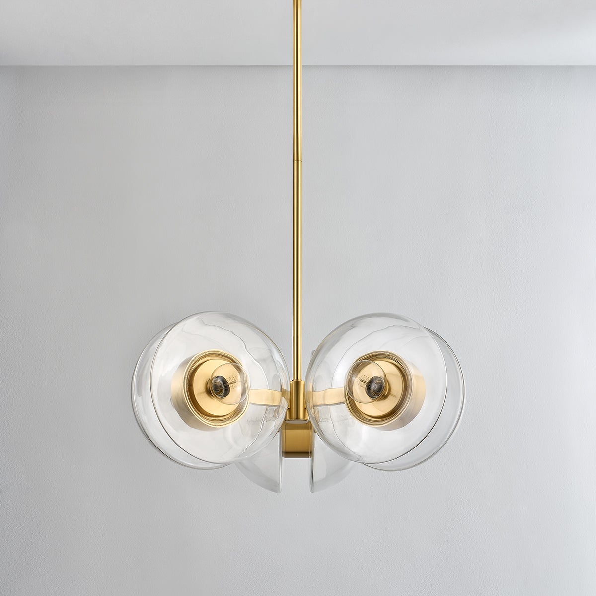 Kert Chandelier 27" in aged brass shown from the front to reveal the frame, arms, and shade detail.