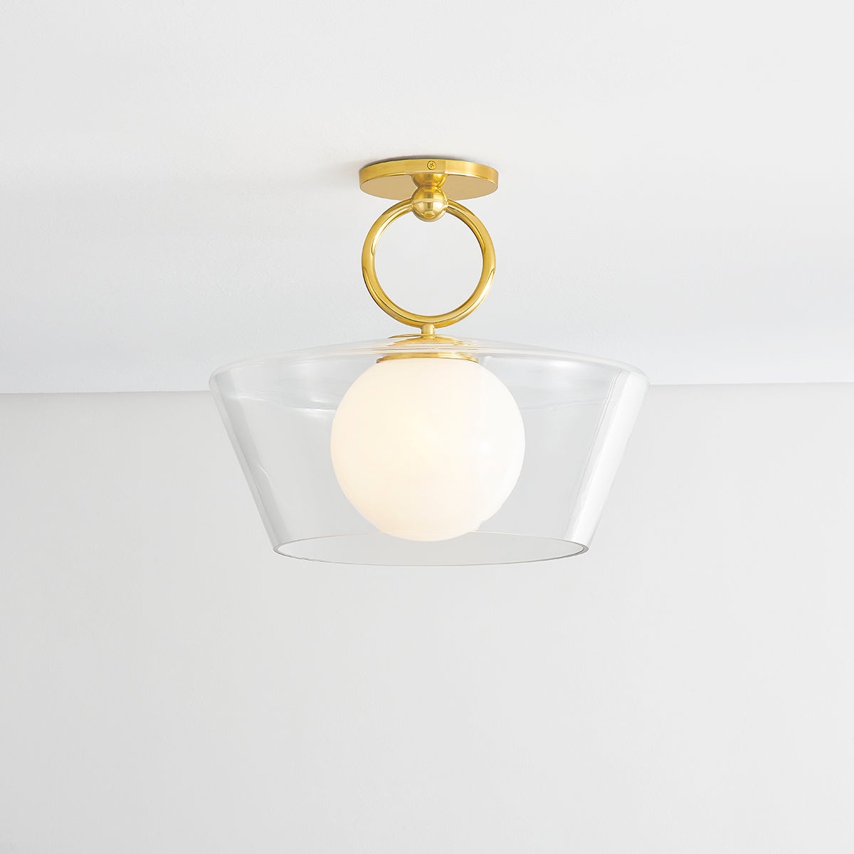 Close-up of the Elmsford Semi Flush in aged brass showing the shade profile and mounting canopy.