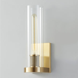 Porter Wall Sconce in aged brass shown from the front to reveal the arm curve and shade silhouette.
