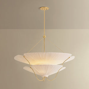 Close-up of the Gerhard Chandelier in aged brass showing the frame, arms, and shade detail.