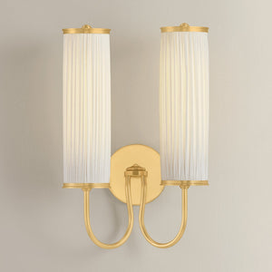 Elaine Wall Sconce in aged brass shown from the front to reveal the arm curve and shade silhouette.