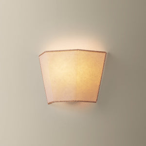 Celmins Wall Sconce 11" shown from a second angle to highlight the arm curve and shade silhouette.