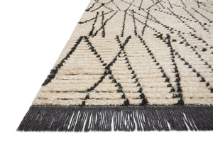 Side view of the Alice Cream / Charcoal by Chris Loves Julia x Loloi (Pattern 1) rug.