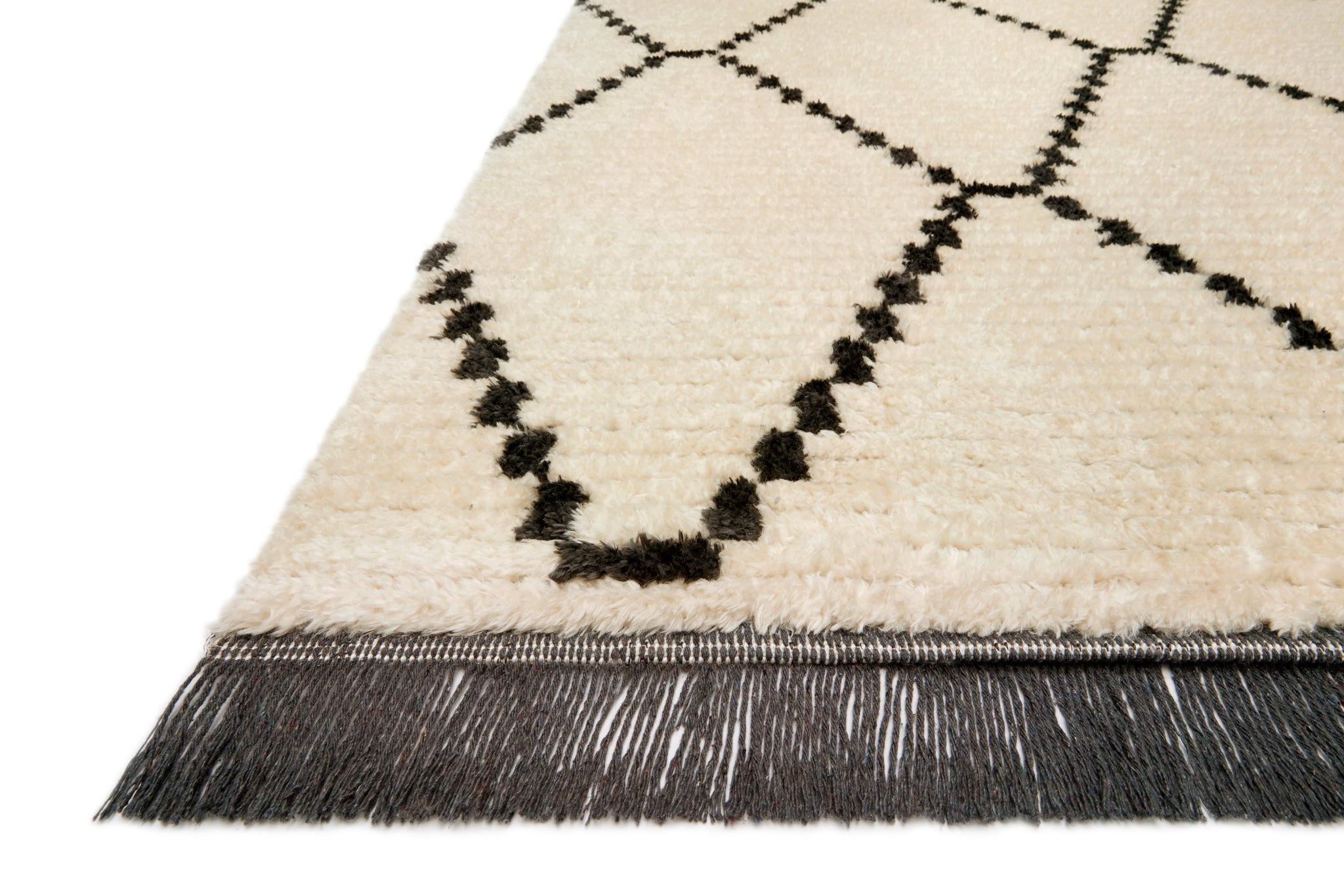 Side view of the Alice Cream / Charcoal by Chris Loves Julia x Loloi (Pattern 4) rug.