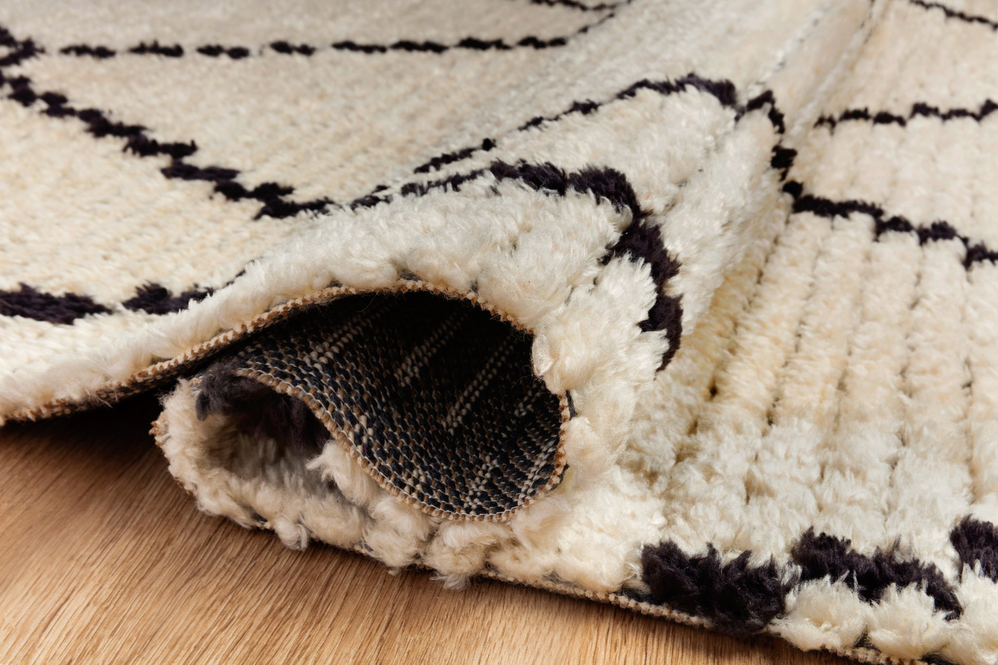 Alice Cream / Charcoal by Chris Loves Julia x Loloi (Pattern 4) styled in a living room at Laurie Yapp Home.
