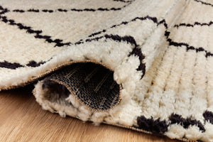 Alice Cream / Charcoal by Chris Loves Julia x Loloi (Pattern 4) styled in a living room at Laurie Yapp Home.