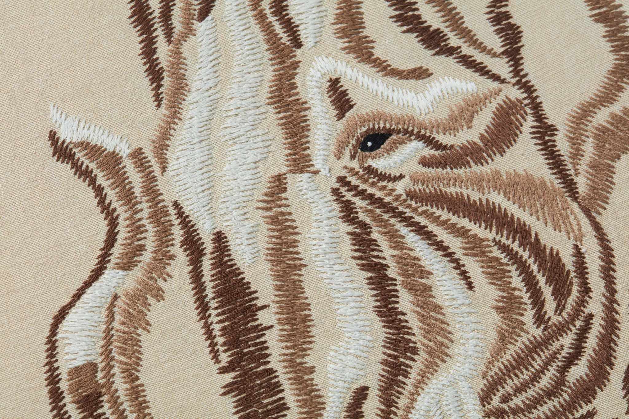Tisk Tusk Beige / Ivory shown from a different angle to reveal its pattern.