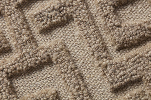 Mythus Beige / Ivory Rug Art shown from a different angle to reveal its pattern.