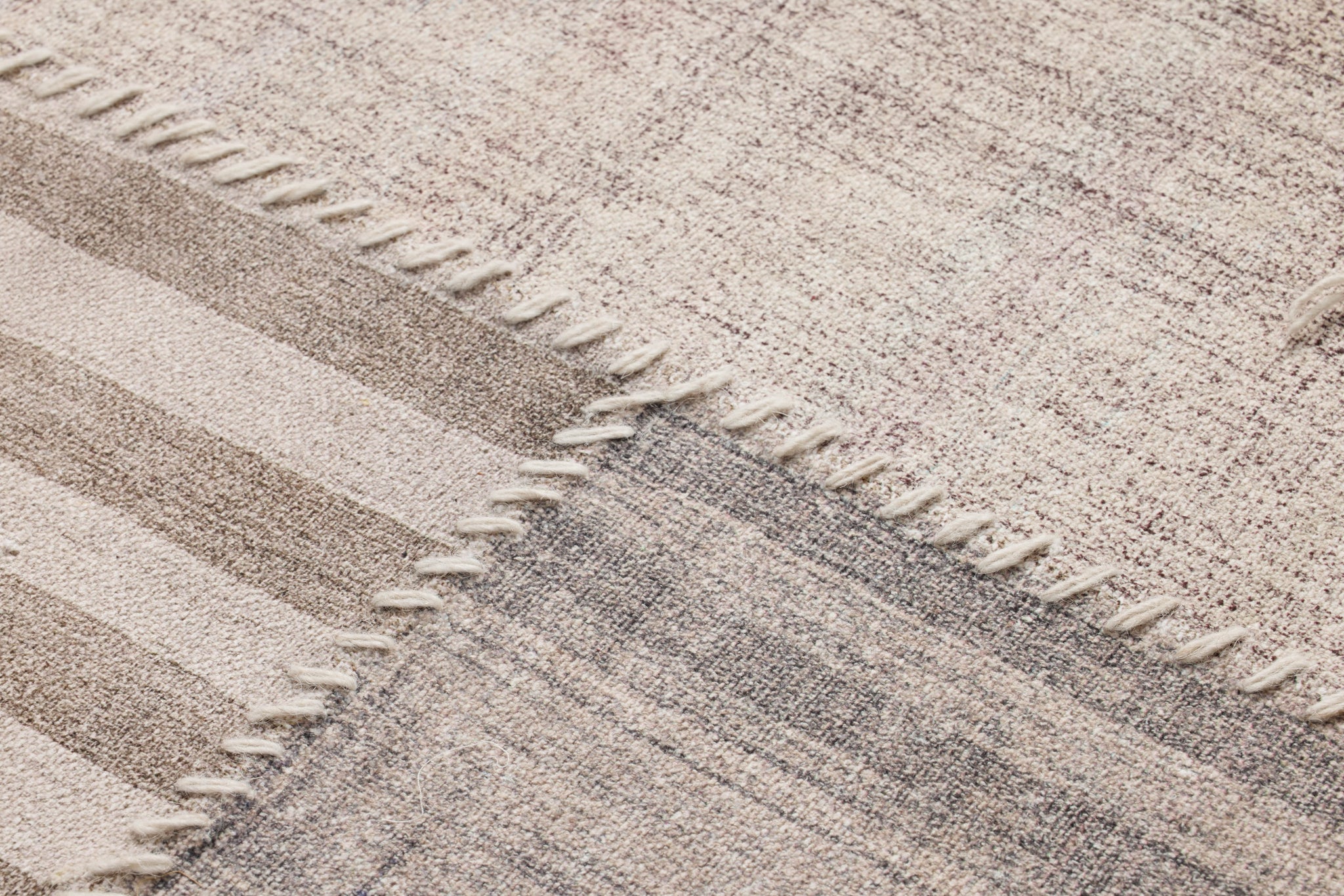 Pieced Work Beige / Brown Rug Art shown from another angle.