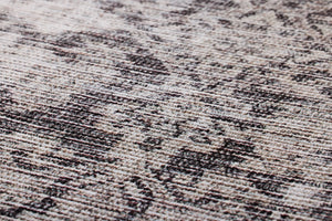Scidrus Black / Grey Rug Art shown from a different angle to reveal its pattern.