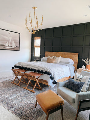 Archie Chandelier 25.25" in aged brass styled in an elegant dining room for warm, layered light at Laurie Yapp Home.