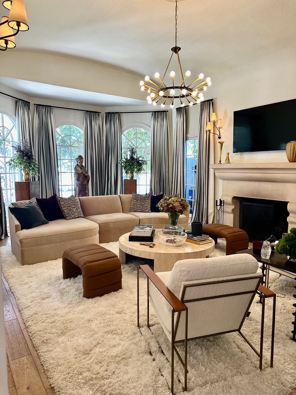 Aries Chandelier styled in an elegant dining room for warm, layered light at Laurie Yapp Home.