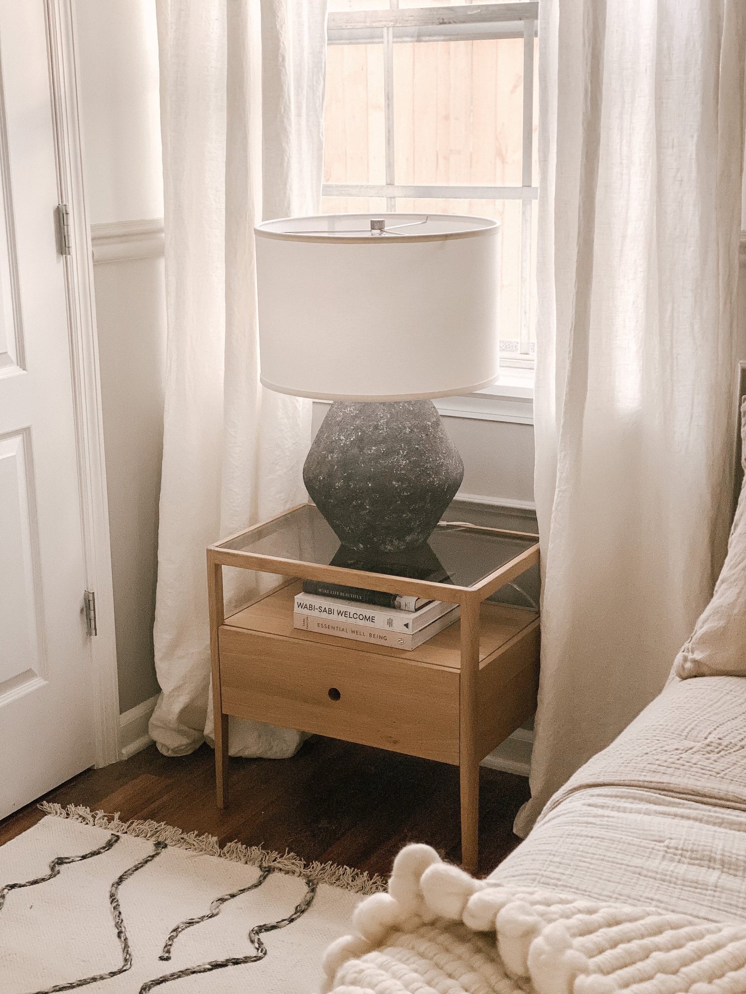 Artifact Table Lamp 16.75" styled in a bedroom nightstand for warm, layered light at Laurie Yapp Home.