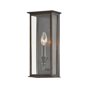 Chauncey Exterior Wall Sconce 6" x 13.25" styled in a warmly lit hallway for warm, layered light at Laurie Yapp Home.