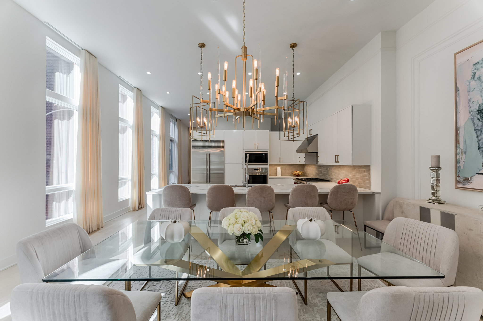 Bari Chandelier 30" in aged brass styled in a formal living room for warm, layered light at Laurie Yapp Home.