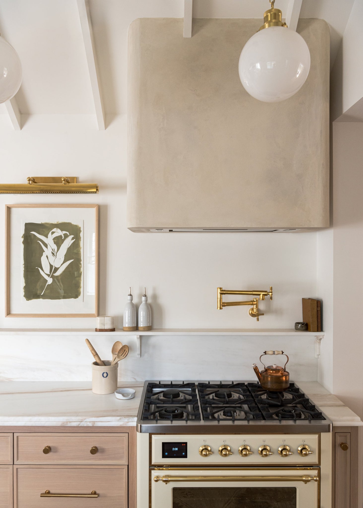 Hampshire Picture Light 23.25" in aged brass styled in a gallery wall for warm, layered light at Laurie Yapp Home.