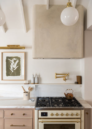 Hampshire Picture Light 23.25" in aged brass styled in a gallery wall for warm, layered light at Laurie Yapp Home.