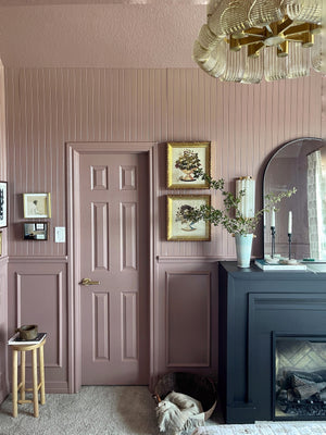 Hillside Wall Sconce 6" x 13.5" in aged brass styled in a curated living room for warm, layered light at Laurie Yapp Home.