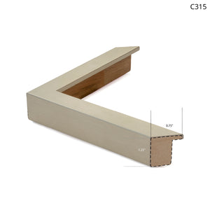 Silver metal frame corner with wooden backing, showcasing modern design and clean lines.