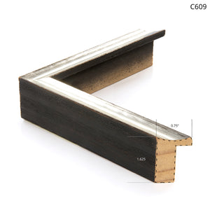 Dark wooden frame corner with a silver accent, highlighting a modern style.