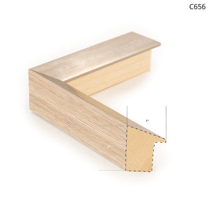 Framing option C656 showcasing a wooden frame with a metallic edge and light wood finish.