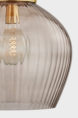 Close-up of the Chatton Pendant 16.5" in aged brass showing the shade shape and metal detail.