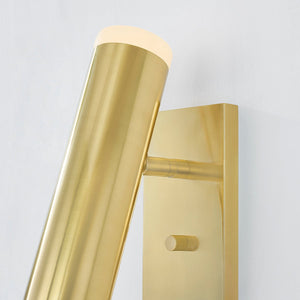 Close-up of the Clark Wall Sconce in aged brass showing the arm curve and shade silhouette.