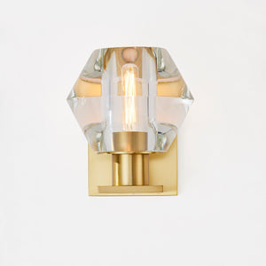 Cooperstown Wall Sconce in aged brass shown from a second angle to highlight the arm curve and shade silhouette.