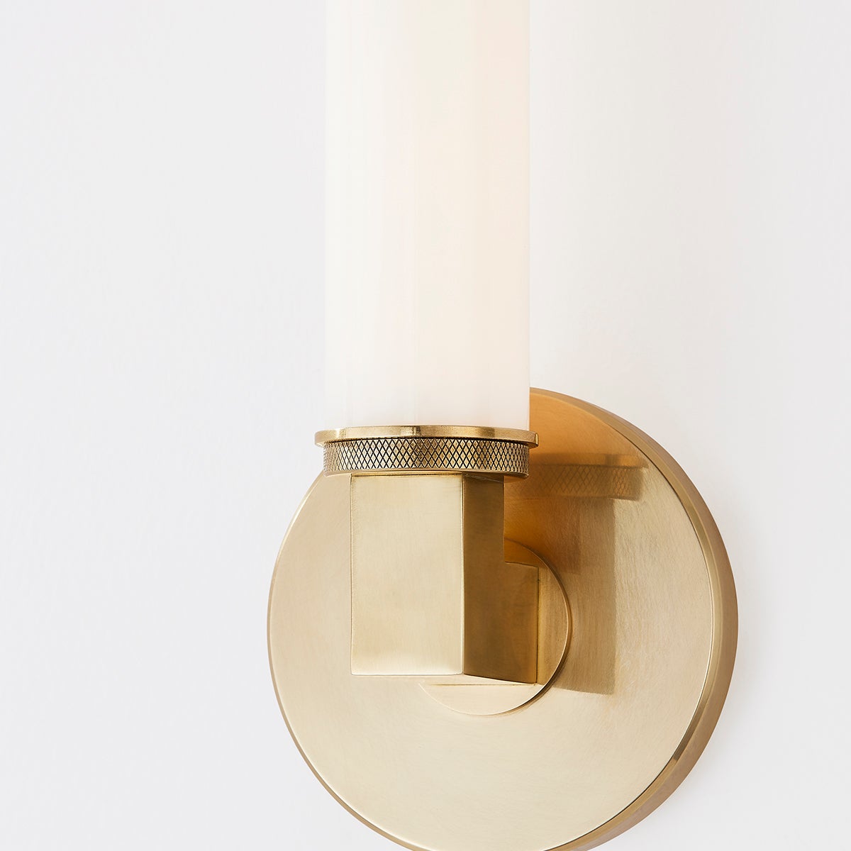 Close-up of the Cromwell Wall Sconce 4.75" x 13.75" in aged brass showing the arm curve and shade silhouette.