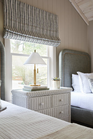 Clic Table Lamp styled in a living room side table for warm, layered light at Laurie Yapp Home.
