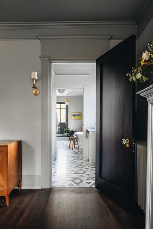 Lambert Pendant 12.5" in aged brass styled in an elegant dining room for warm, layered light at Laurie Yapp Home.