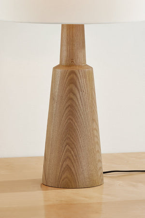 Dennis Table Lamp in aged brass shown from a second angle to highlight the base and shade proportions.