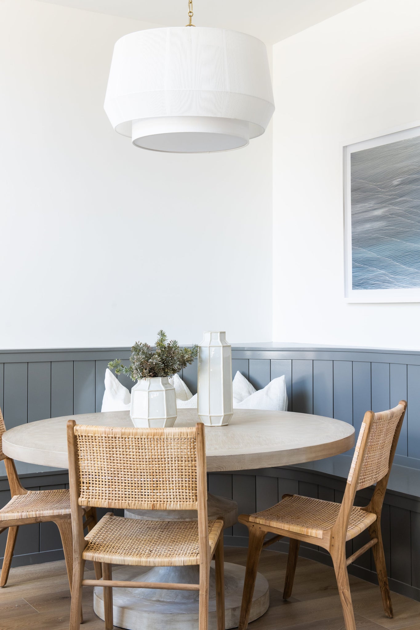 Debi Pendant 30.5" in aged brass styled in a welcoming entryway for warm, layered light at Laurie Yapp Home.