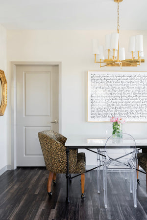Dillon Chandelier 30" in aged brass styled in an elegant dining room for warm, layered light at Laurie Yapp Home.