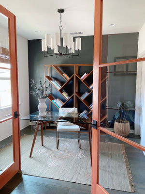 Dillon Chandelier 30" in bronze styled in a formal living room for warm, layered light at Laurie Yapp Home.