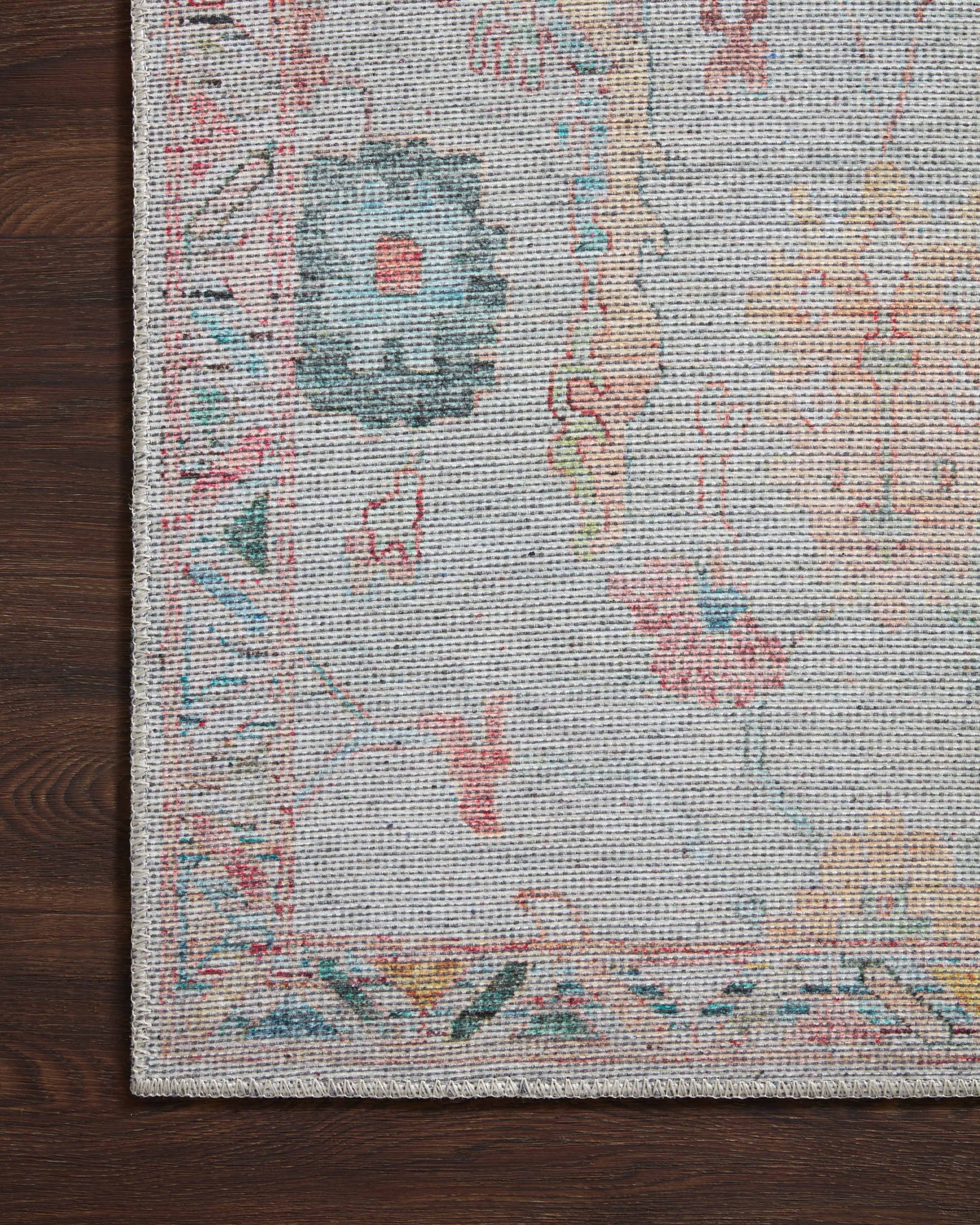 Elysium Pebble / Multi shown in a curated living room setting at Laurie Yapp Home.
