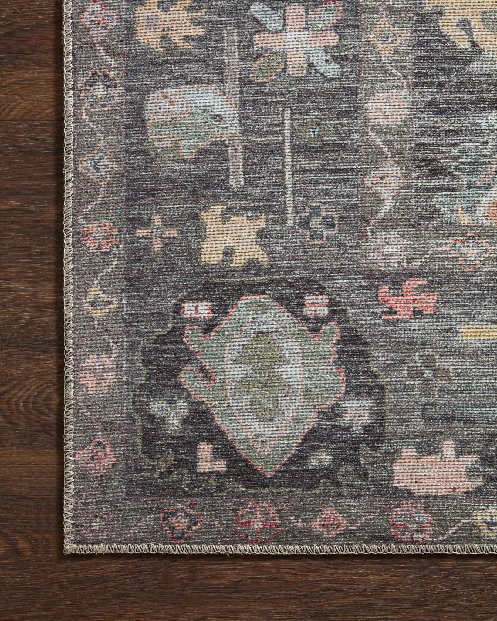 Elysium Charcoal / Multi shown in a curated living room setting at Laurie Yapp Home.