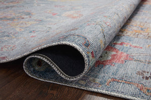 Elysium Denim / Multi shown in a curated living room setting at Laurie Yapp Home.