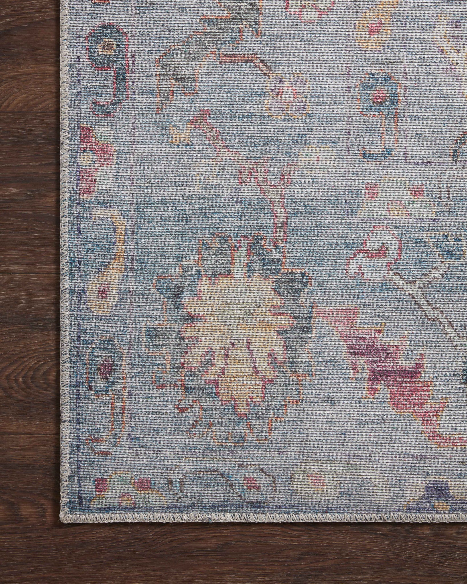 Elysium Denim / Multi styled in a living room at Laurie Yapp Home.