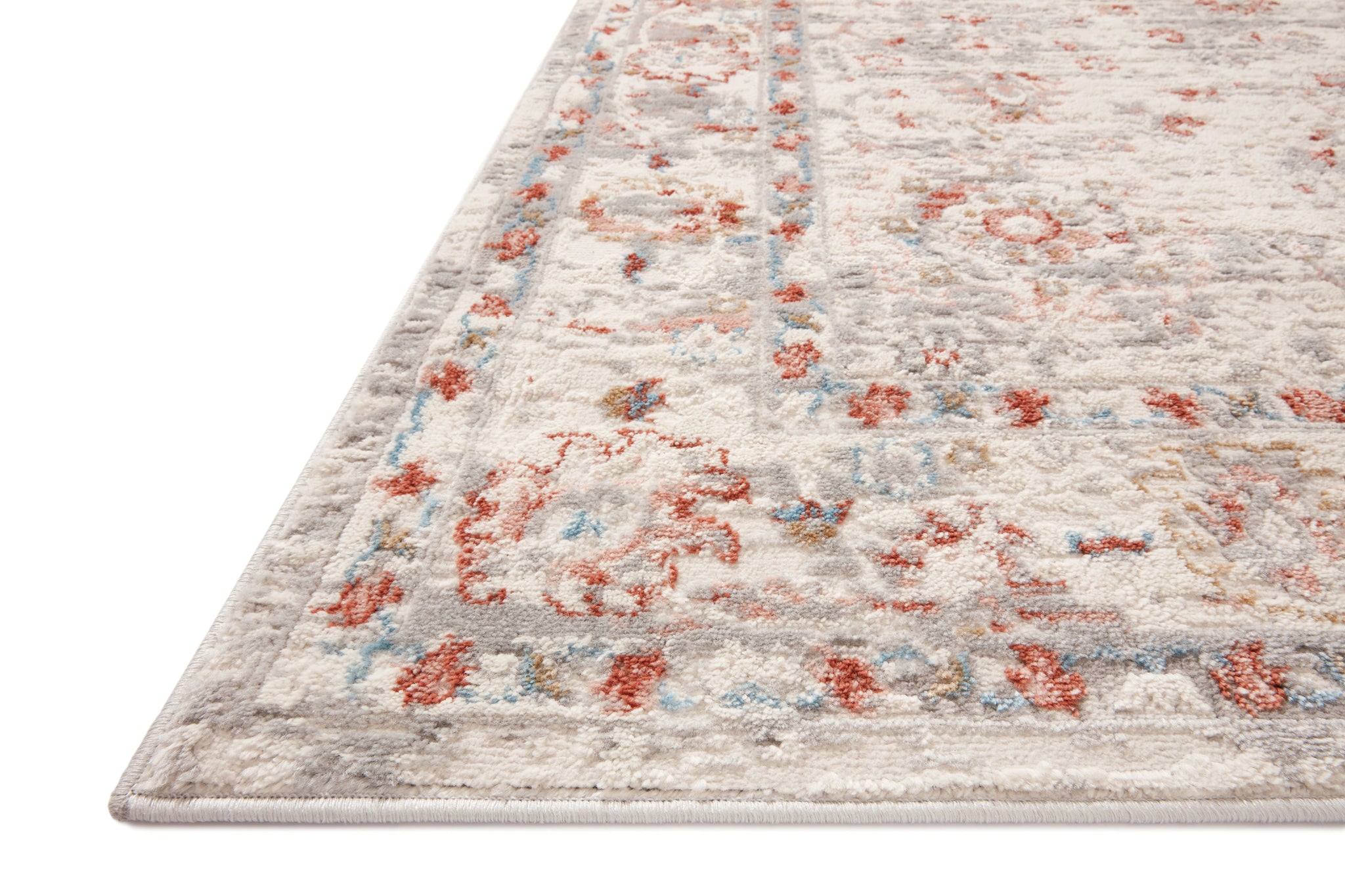 Side view of the Estelle Ivory / Rust rug.