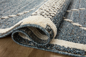 Close-up detail of the Fabian Denim / Charcoal showing its pile and weave.