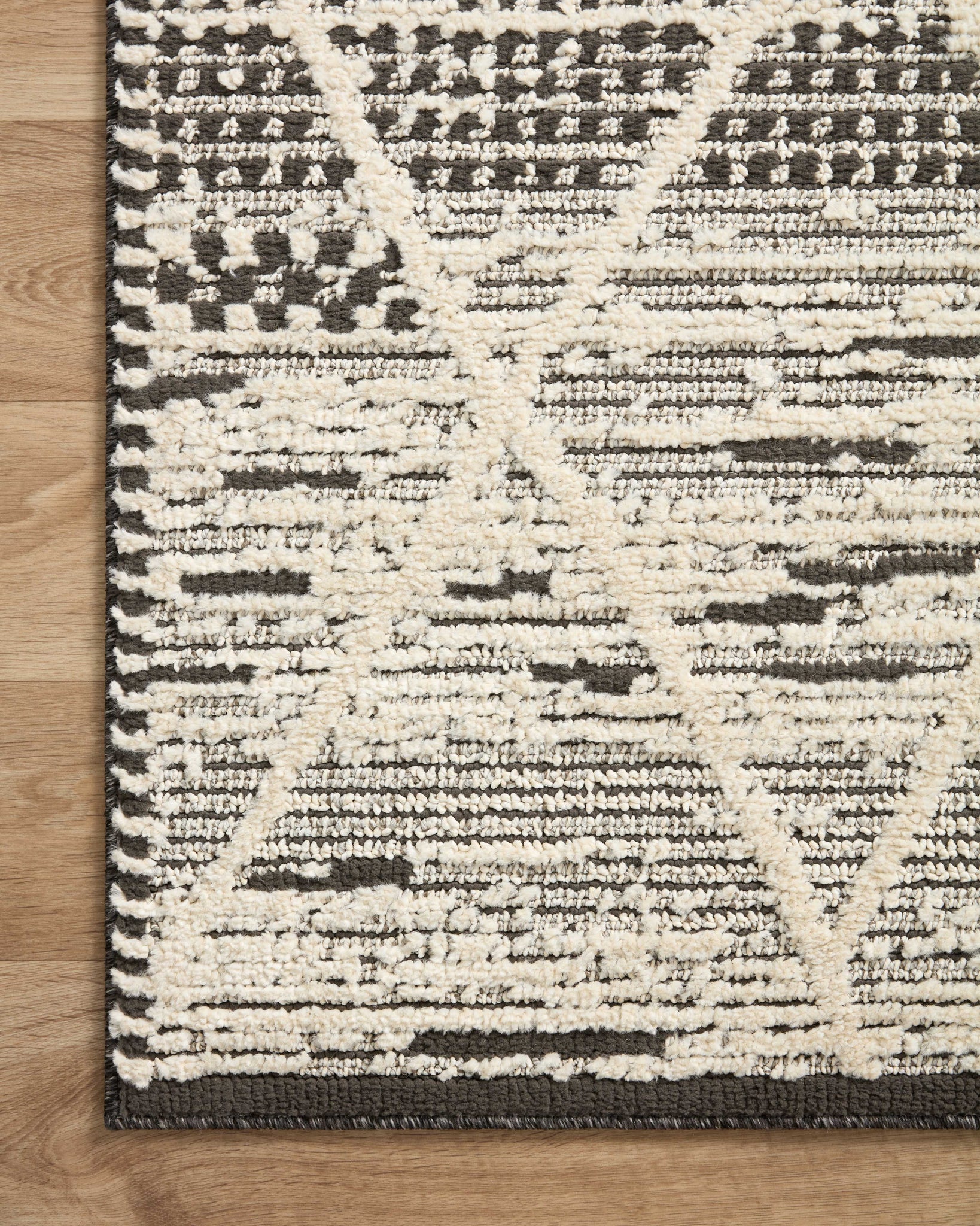 Fabian Charcoal / Ivory (Pattern 3) styled in a living room at Laurie Yapp Home.