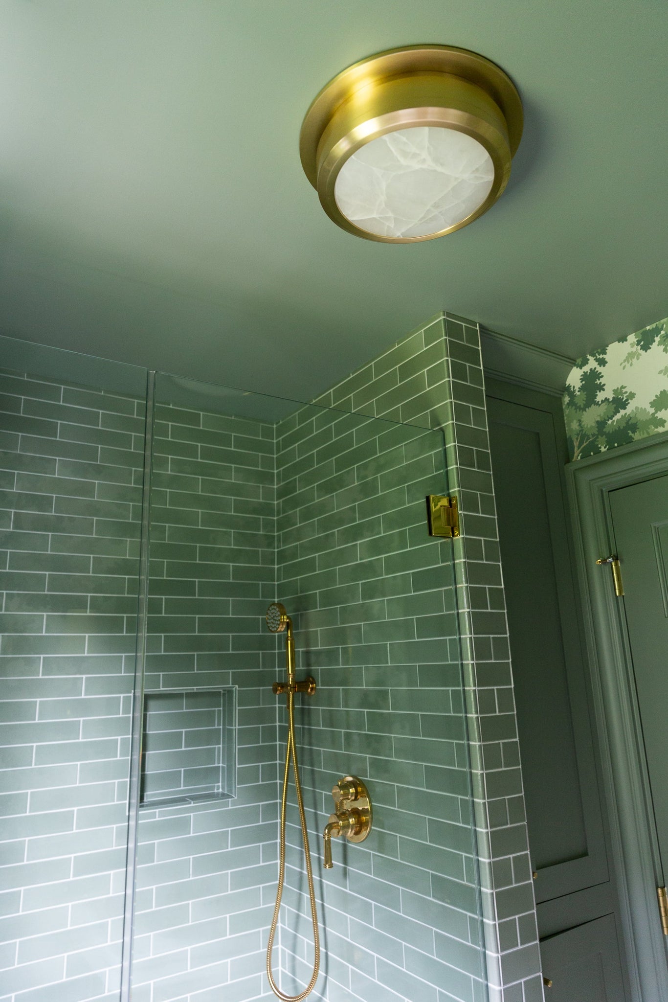 Greenport Flush Mount 14" in aged brass styled in a hallway for warm, layered light at Laurie Yapp Home.