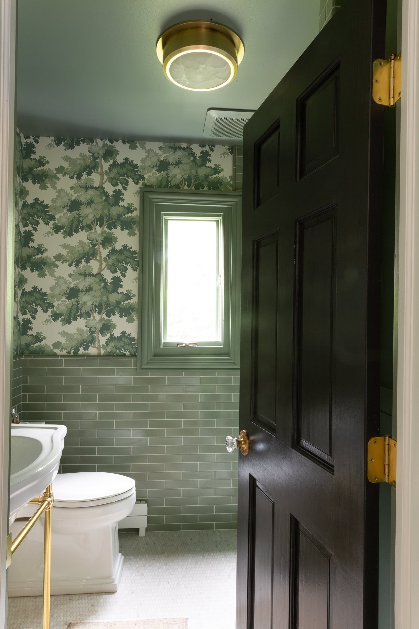 Greenport Flush Mount 14" in aged brass styled in a bedroom for warm, layered light at Laurie Yapp Home.