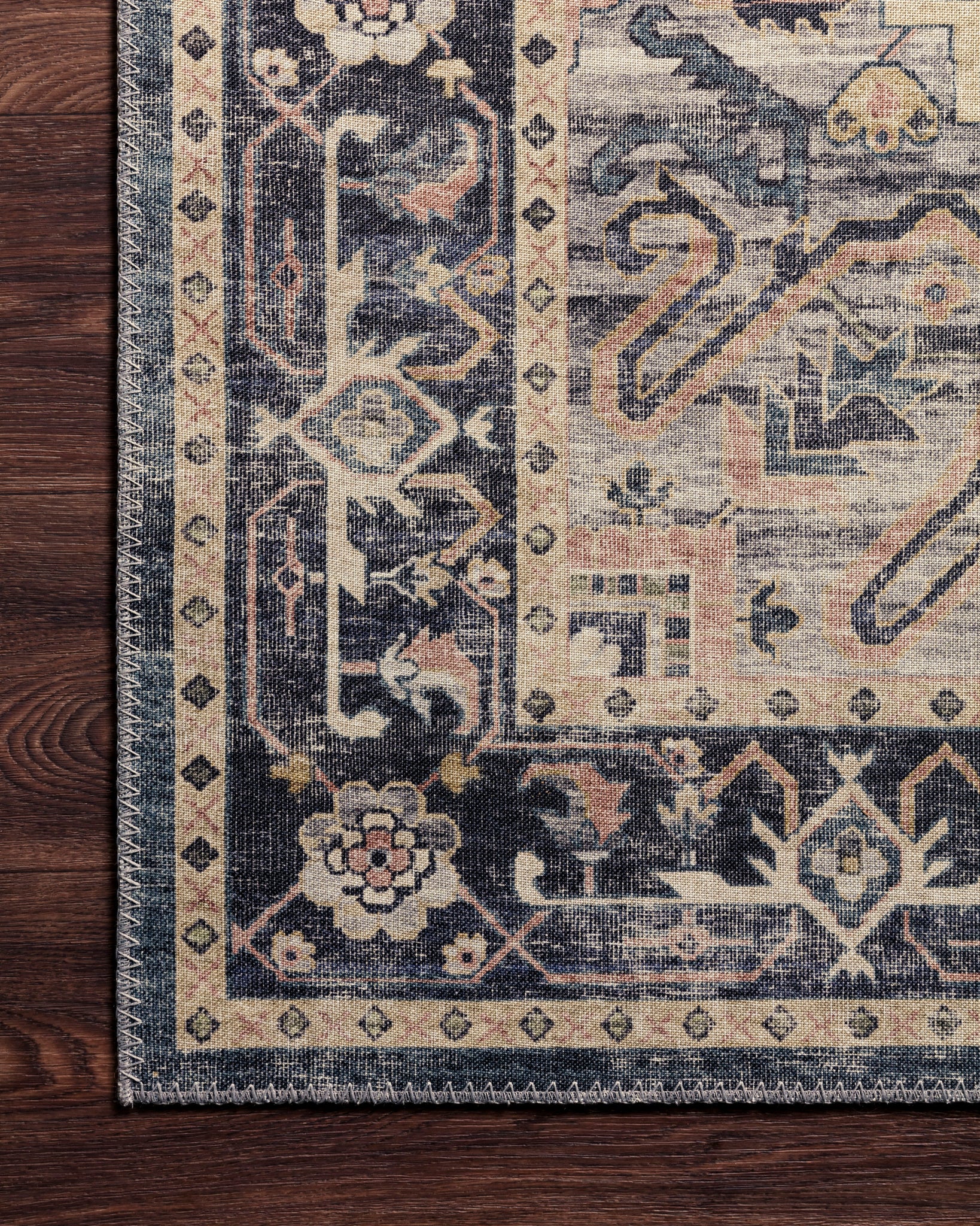 Hathaway Navy / Multi shown in a styled living room vignette at Laurie Yapp Home.