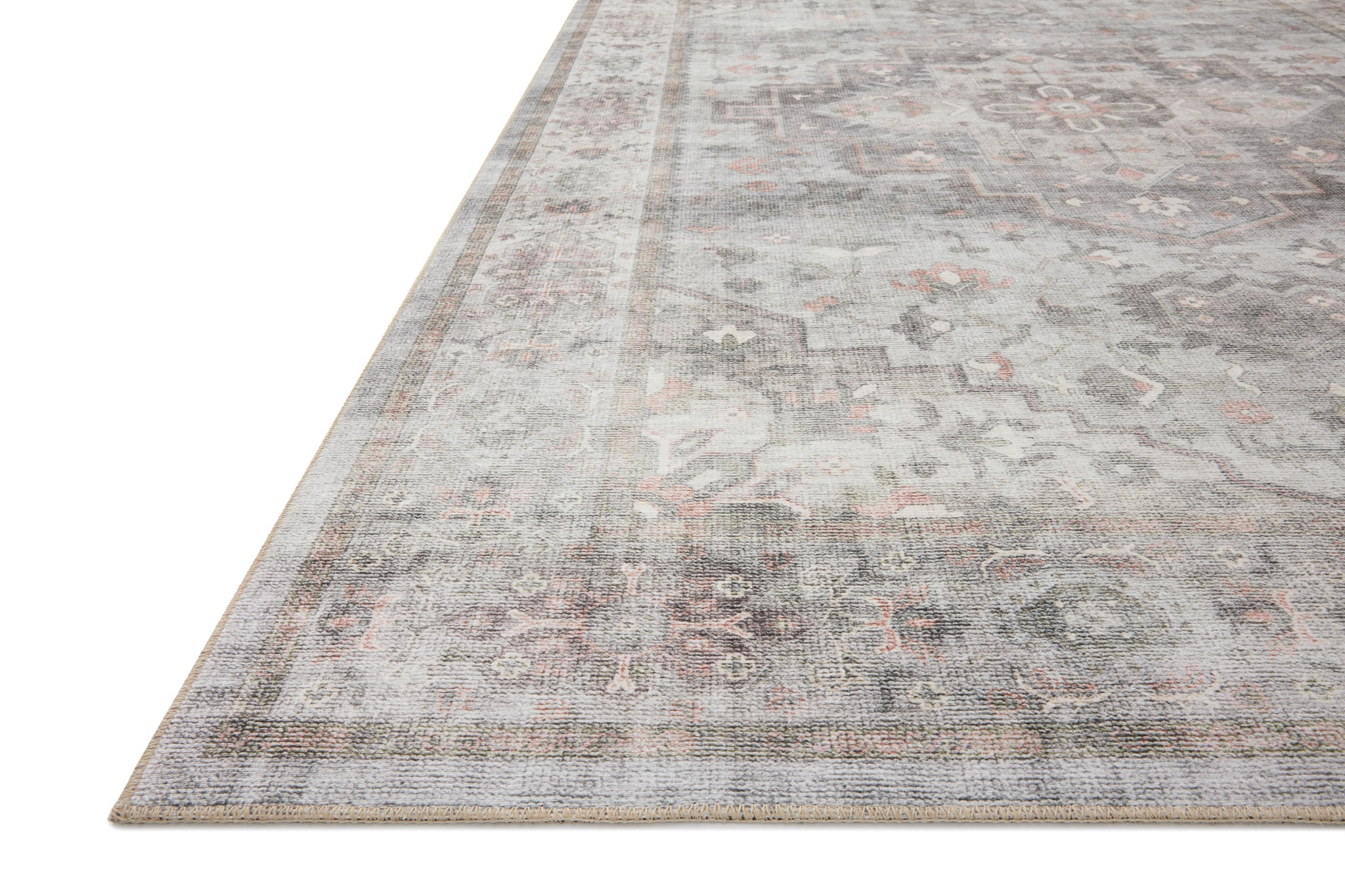 Side view of the Heidi Dove / Blush rug.
