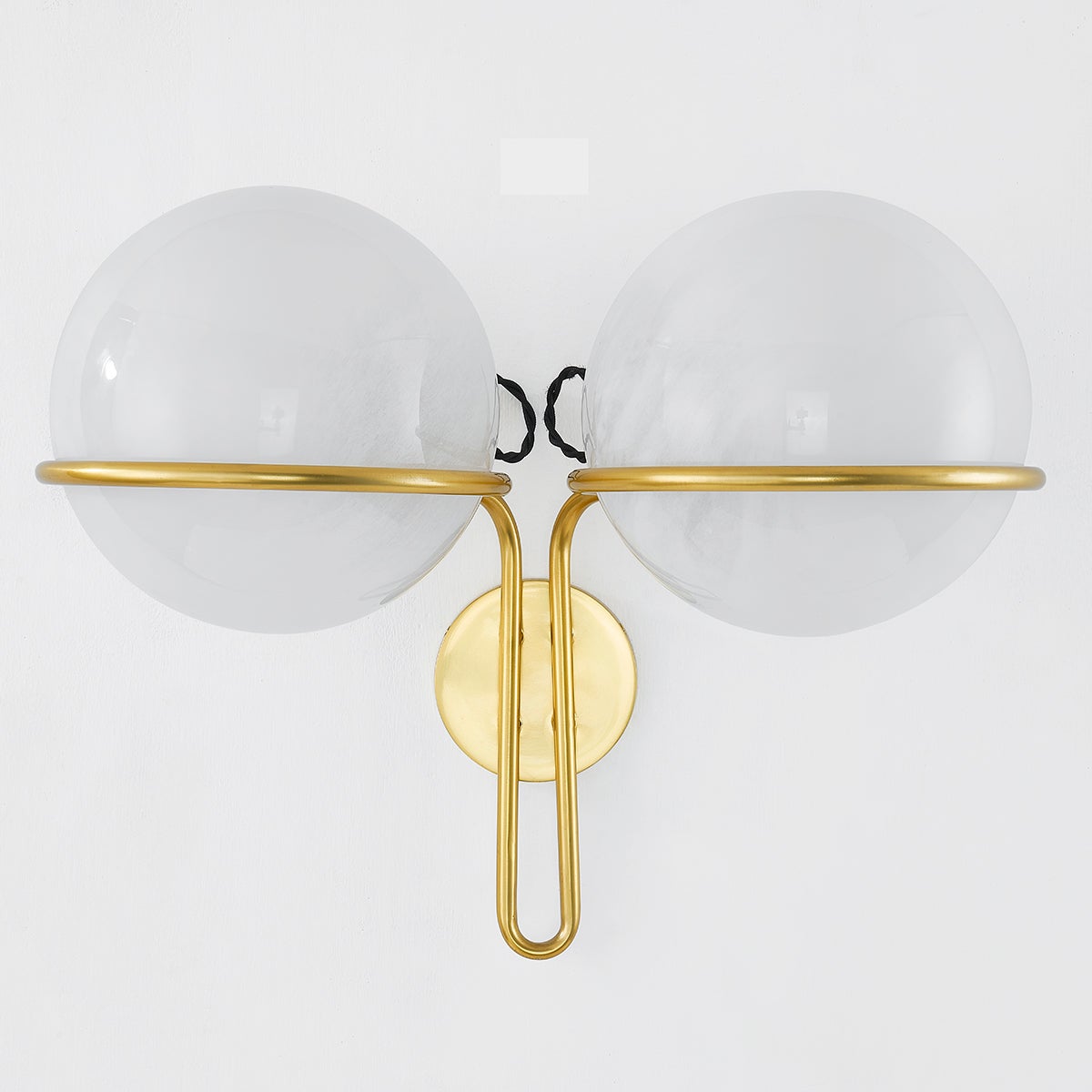 Hingham Wall Sconce in aged brass shown from a second angle to highlight the arm curve and shade silhouette.
