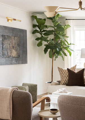 Hallstead Picture Light 24" in aged brass styled in a gallery wall for warm, layered light at Laurie Yapp Home.