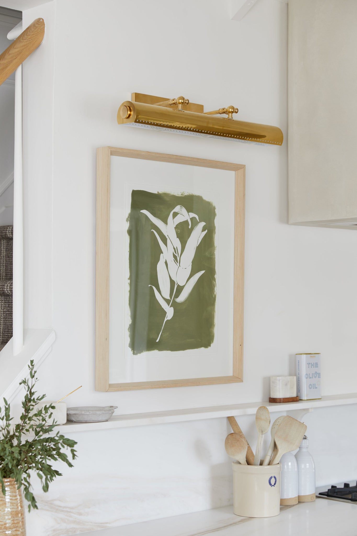 Hampshire Picture Light 23.25" in aged brass styled in a gallery wall for warm, layered light at Laurie Yapp Home.